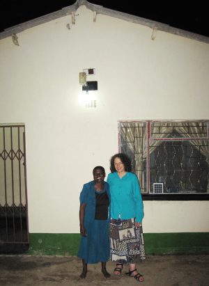 With Erica Azim in Front of the House Patience Built with her 2009 MBIRA Tour Proceeds