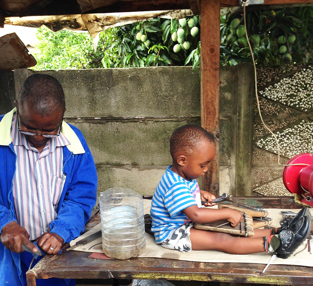 Fradreck Mujuru making mbiras together with his grandson 2014