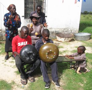 Children from the Rwizi area of Mhondoro Communal Area, behind the village store, playing for visitors with support from their teachers.